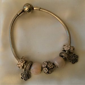 Pandora bracelet with primrose charms